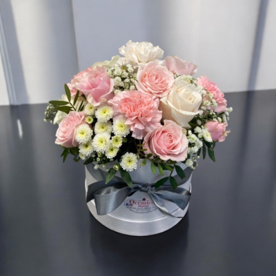 Vintage Hatbox - Containing carnations, roses and other traditional English country garden flowers arranged in a wet floral foam for easy care. Different colours can be requested please state