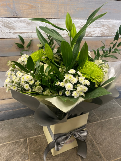 Blanket of Snow - A calm, cool and refreshing hand-tied of snowy blooms in shades of white and cream.