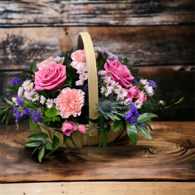 Bon Bon Basket - We are pleased to introduce this stunning basket arrangement, made in floral foam for easy care with pink and purple blooms in a stylish basket, perfect to place anywhere in the ho