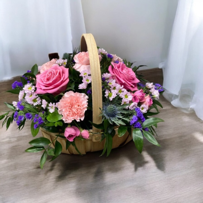 Bon Bon Basket - We are pleased to introduce this stunning basket arrangement, made in floral foam for easy care with pink and purple blooms in a stylish basket, perfect to place anywhere in the ho