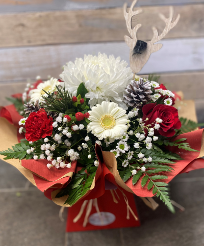 Santa Baby - A selection of customer favourite flowers and foliage in a design that's simply the perfect Christmas present.